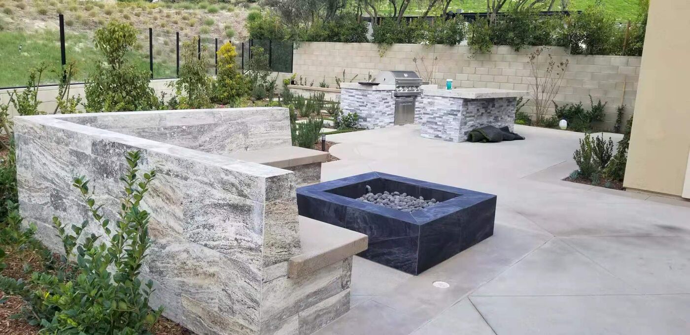Quartzite bench wall and black fire pit