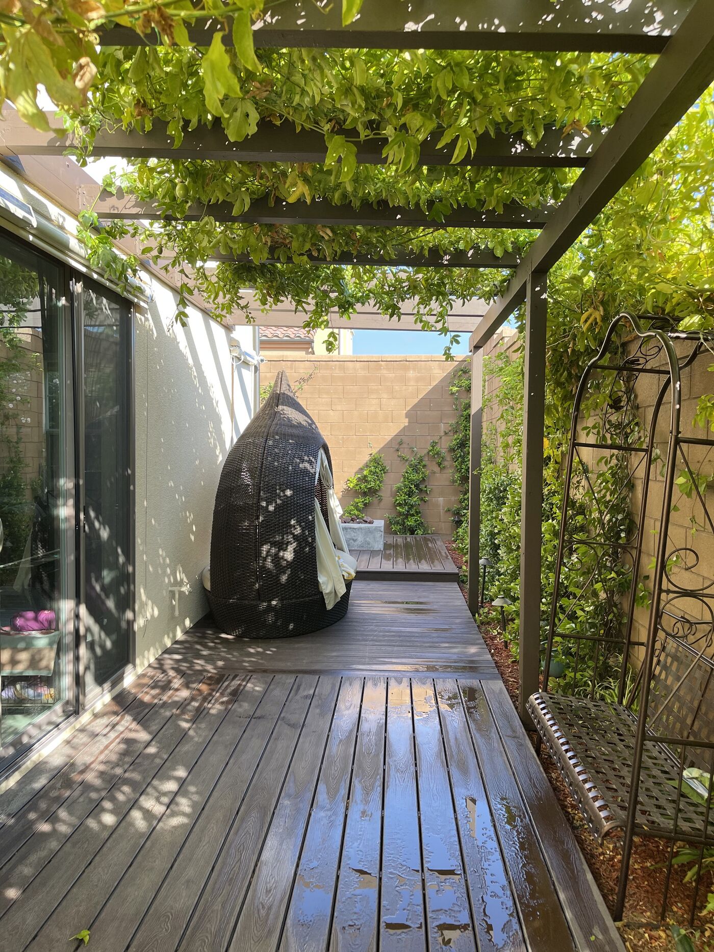 Vine-covered arbor walkway and garden room