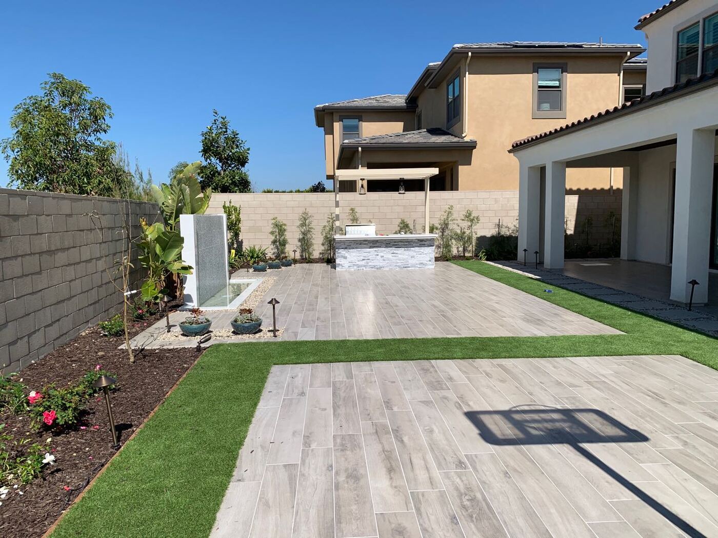 Travertine terrace with lawn inlay