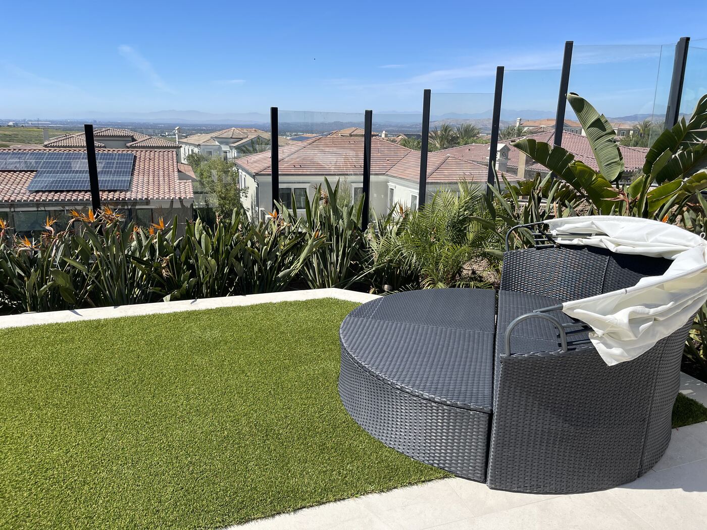 Round daybed on a hillside deck