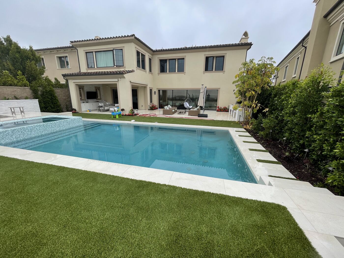 Pool with loungers on turf