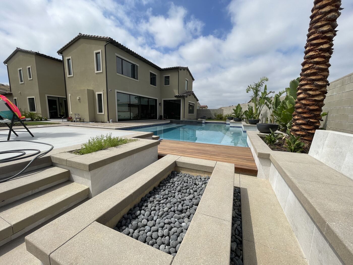 Modern house with pool and pebble bed