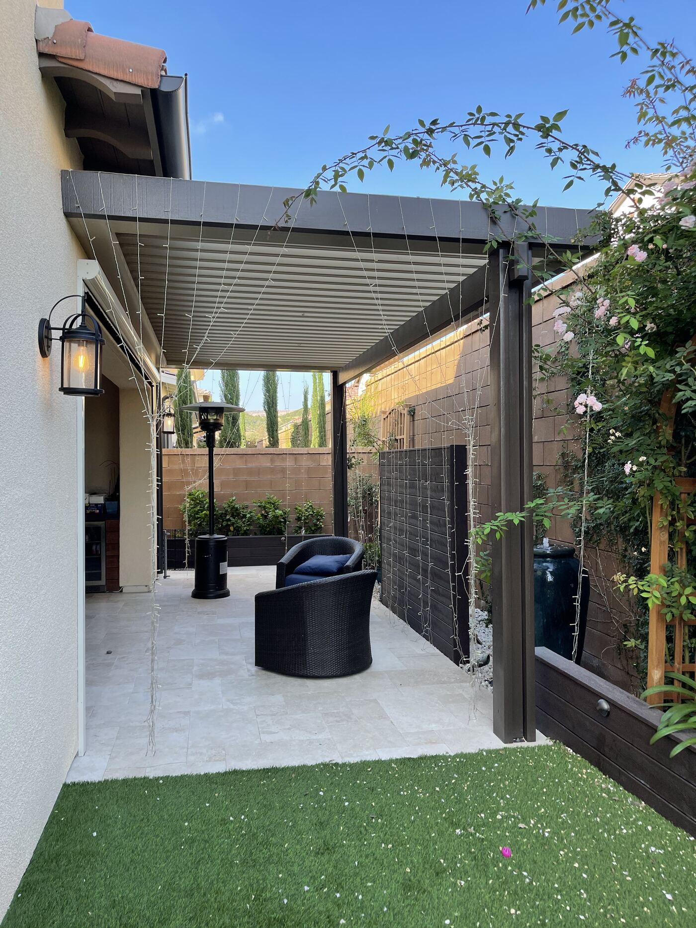 Putting green beside pool and palms