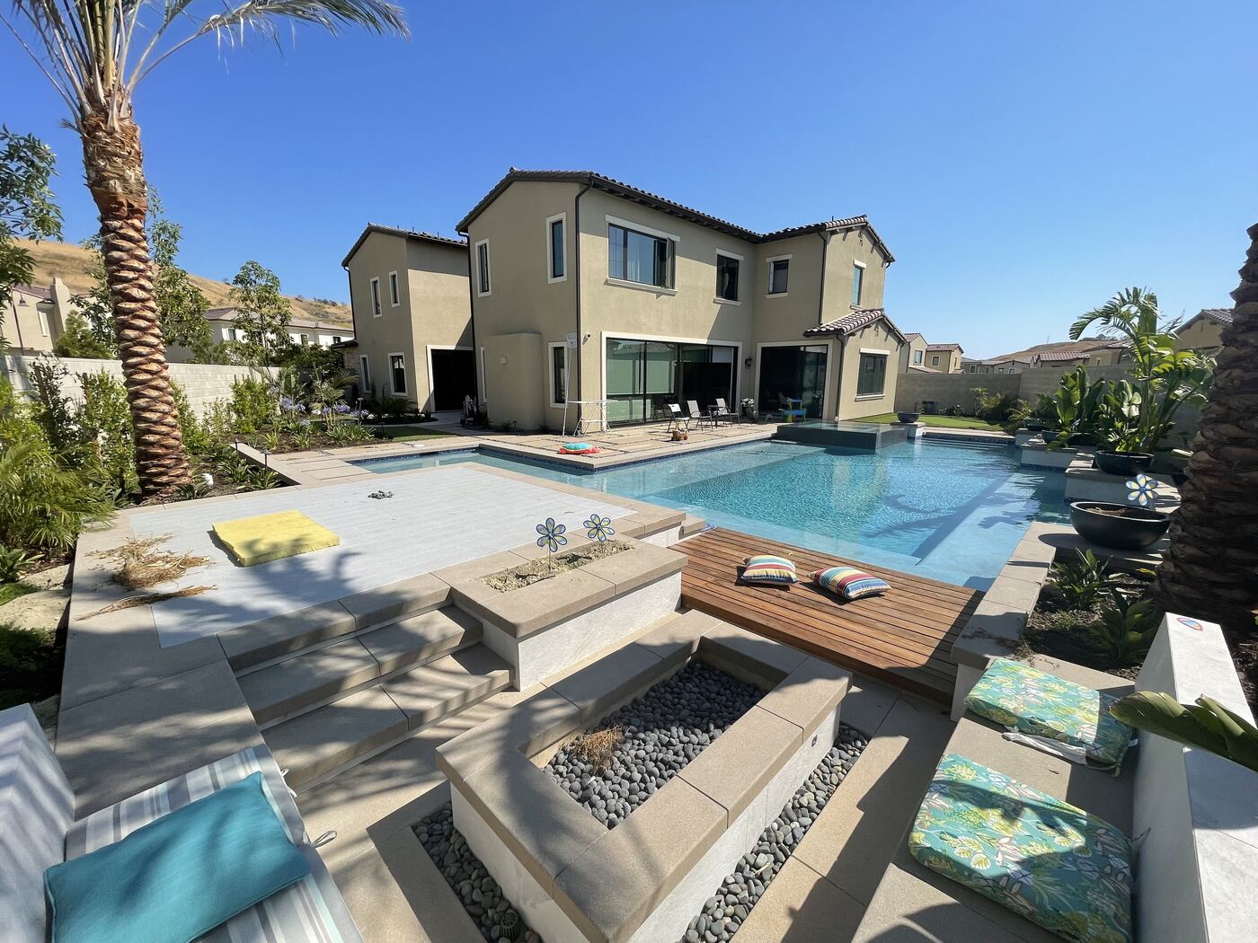 Pool with daybed and fire table