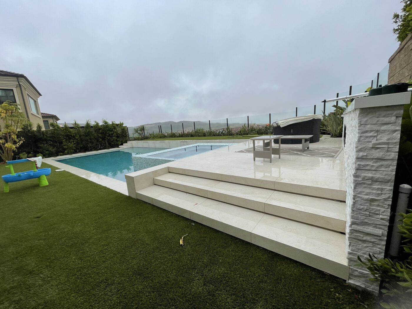 Pool steps and white loungers