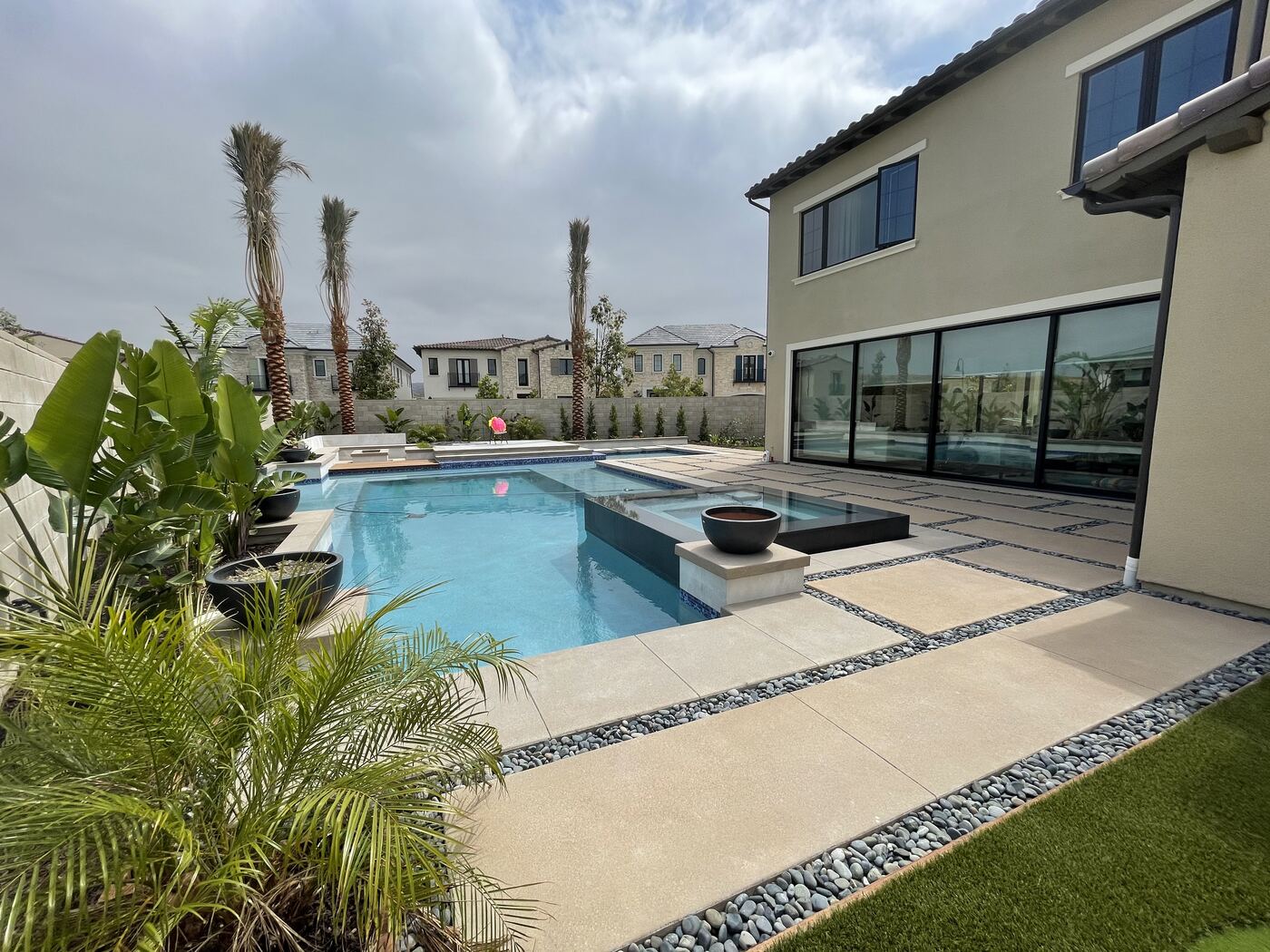 Raised spa with palm backdrop