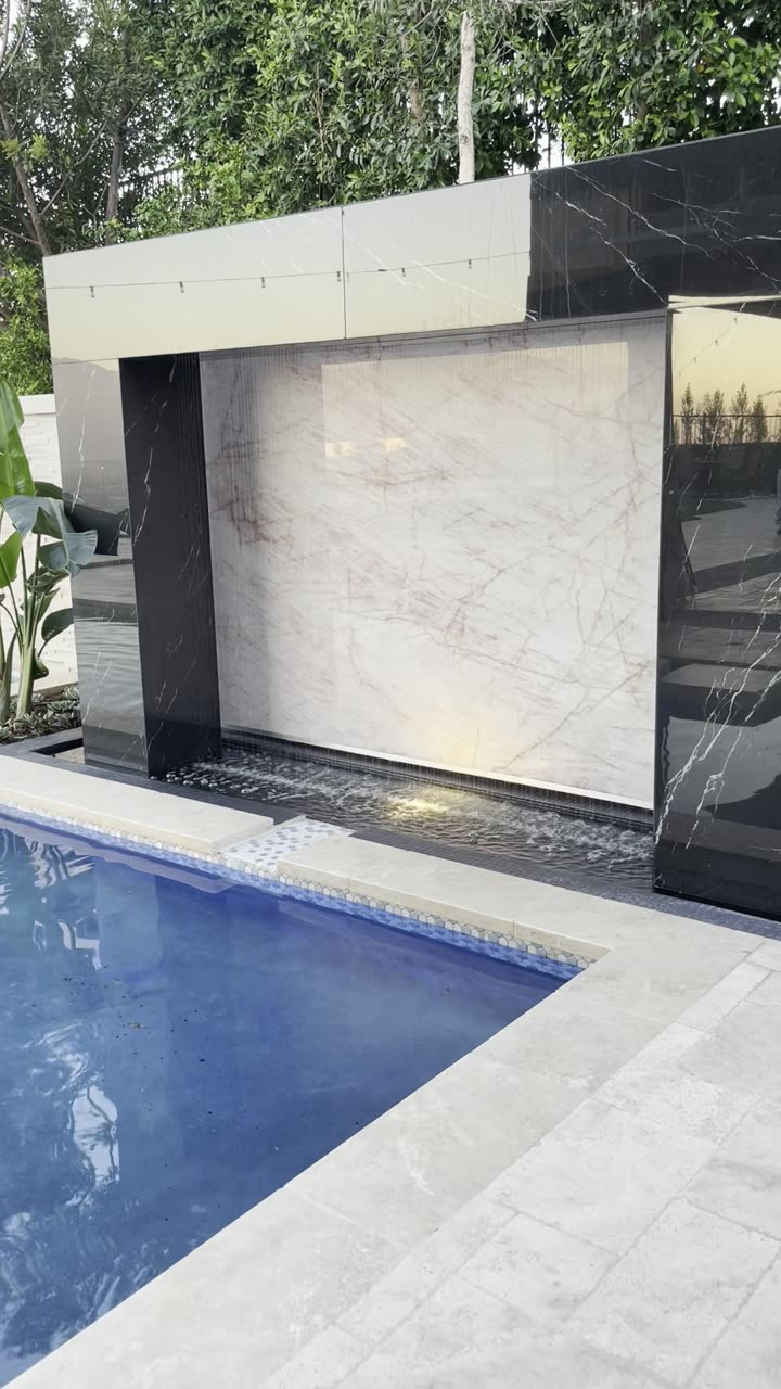 Marble water wall glowing at night