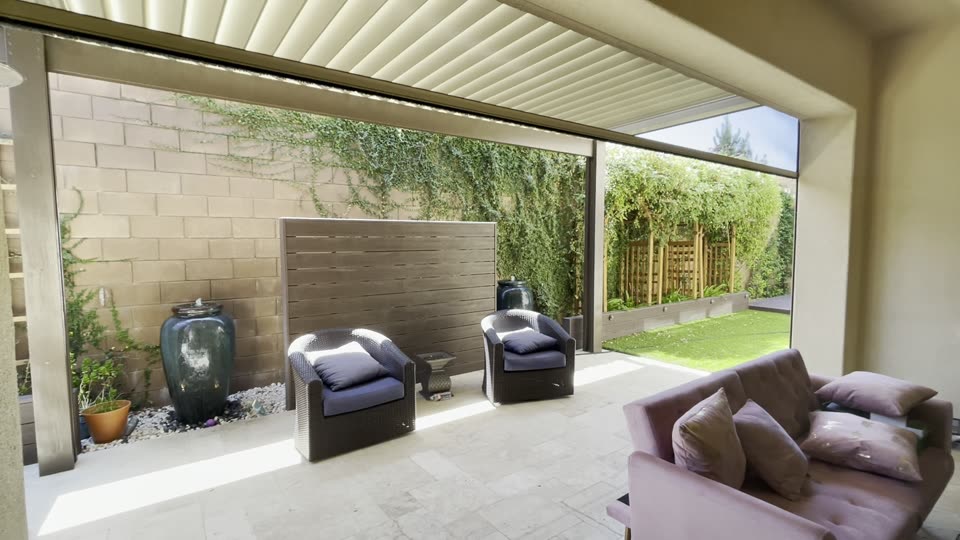 Sliding glass wall opening to a patio